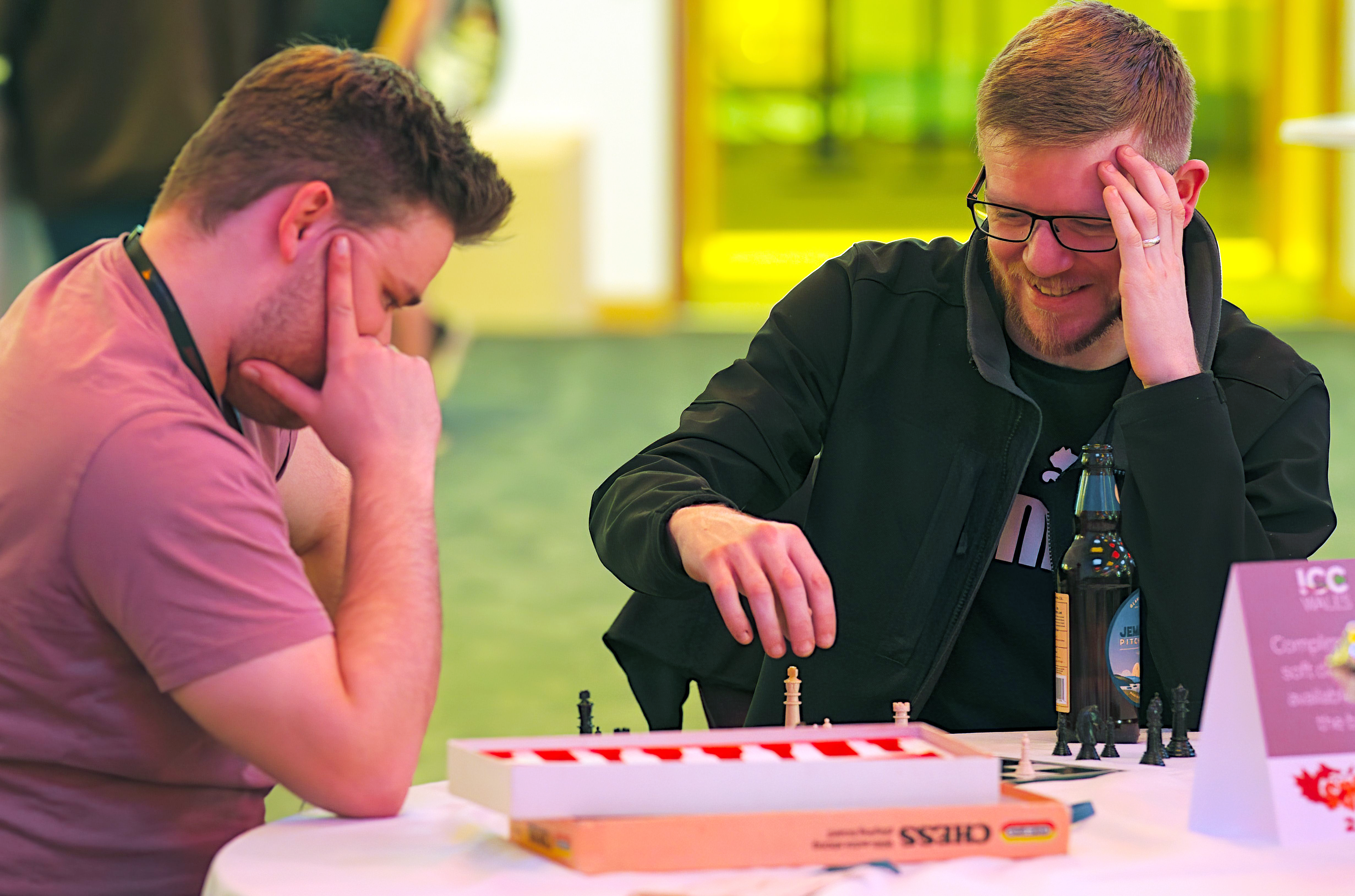 Two people playing a game at SQLBits Game night 2023